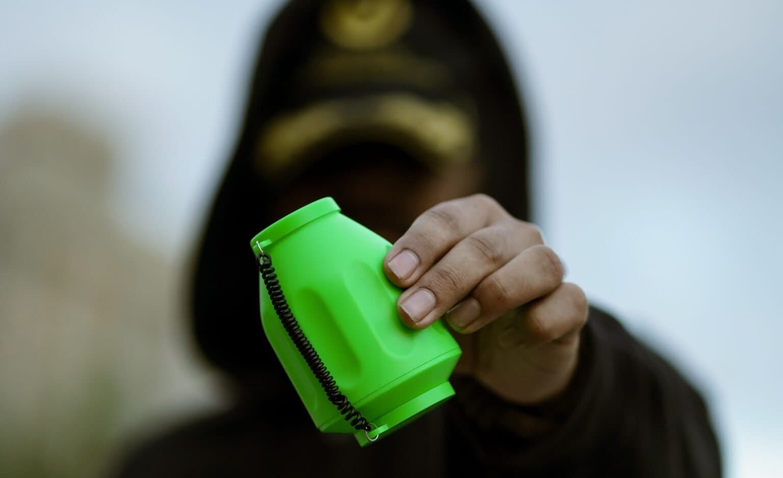 Person holding Smogo Nade device